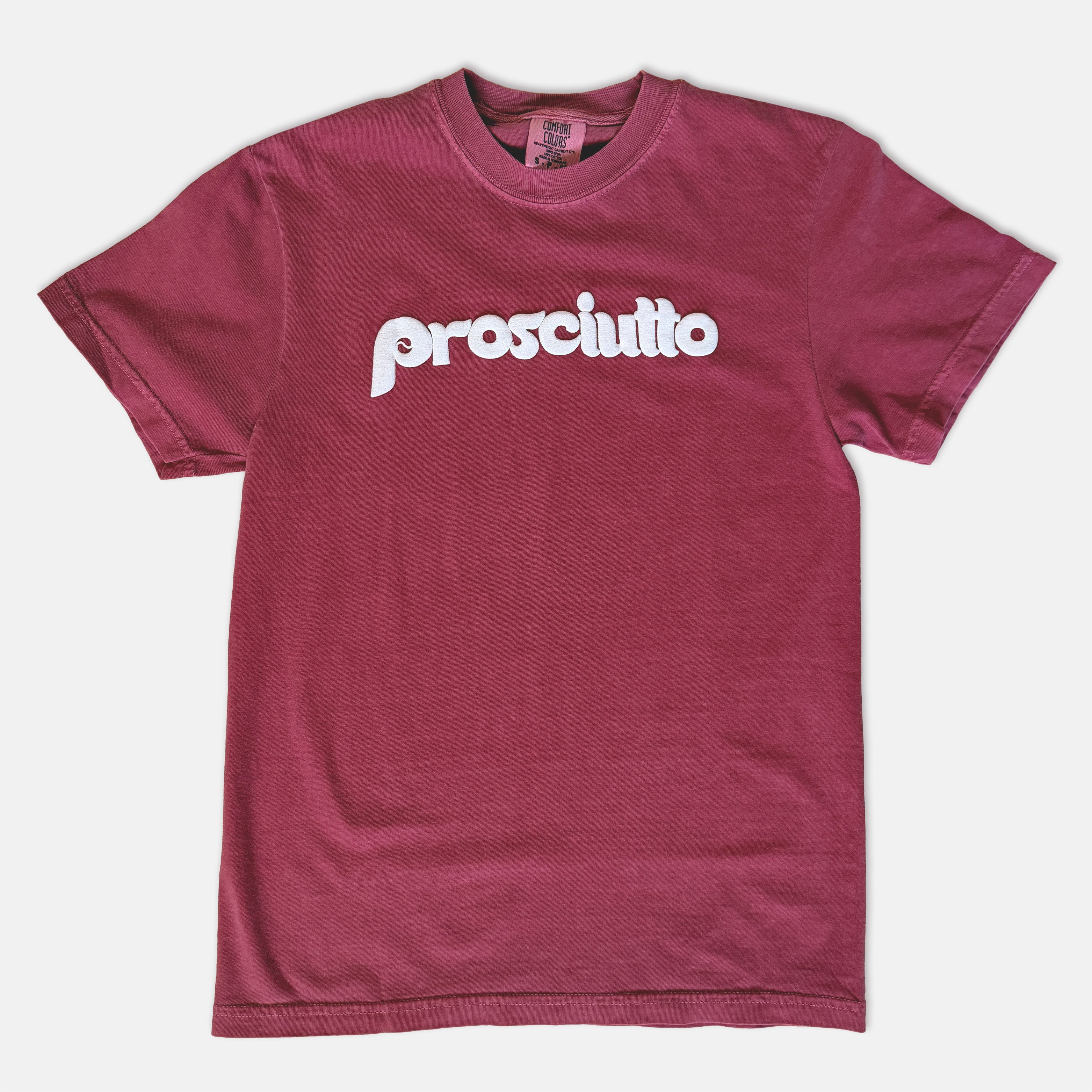 Burgundy t-shirt with 'prosciutto' text in white